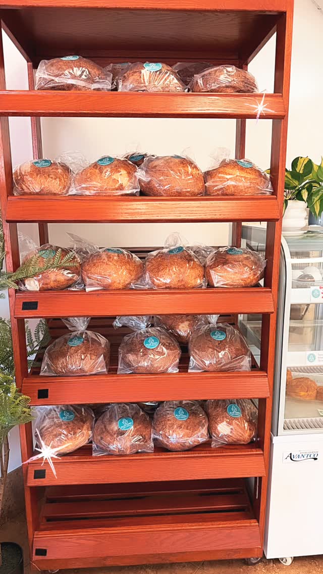 Fresh sourdough loaves on the bakery rack