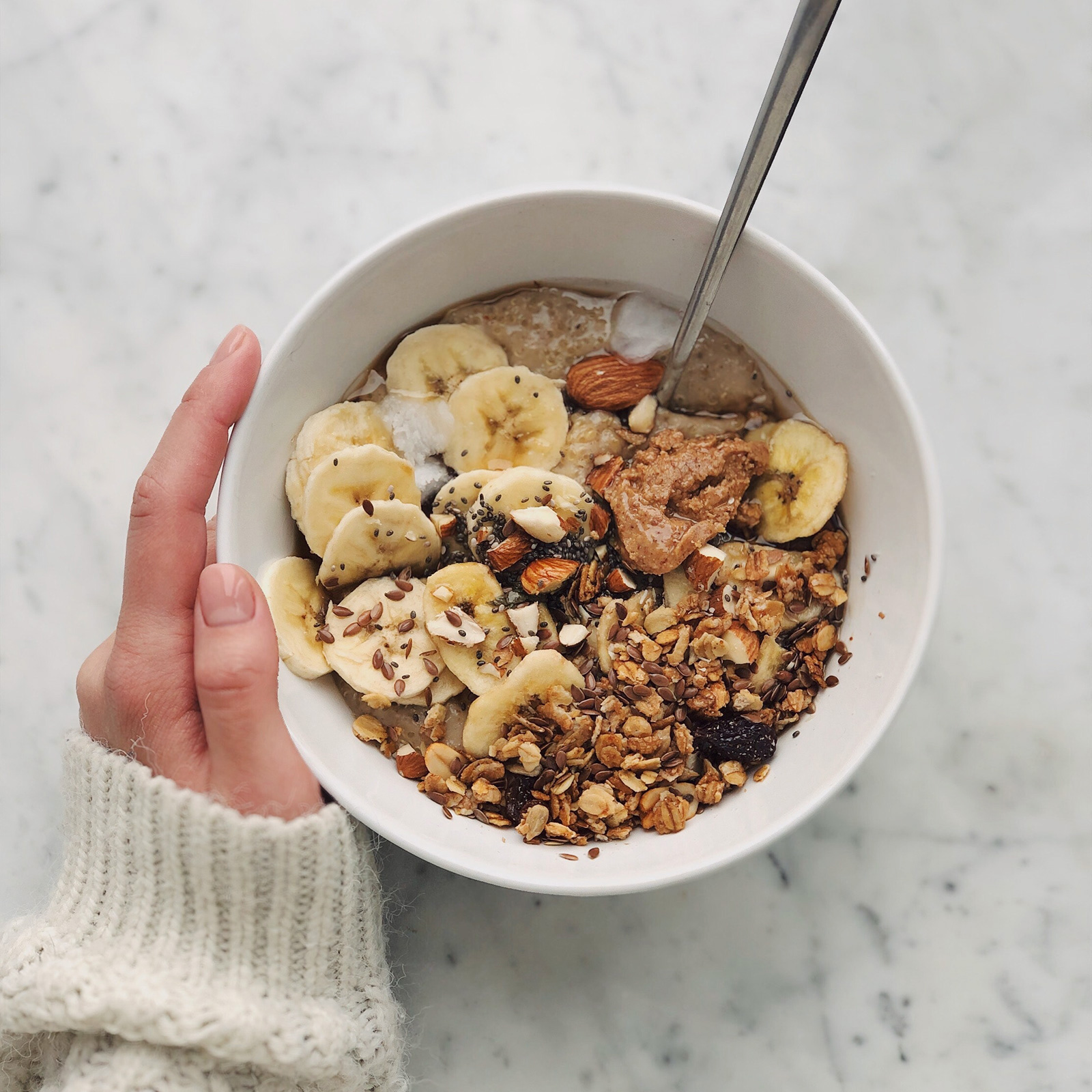 Breakfast oat bowl with banana and granola
